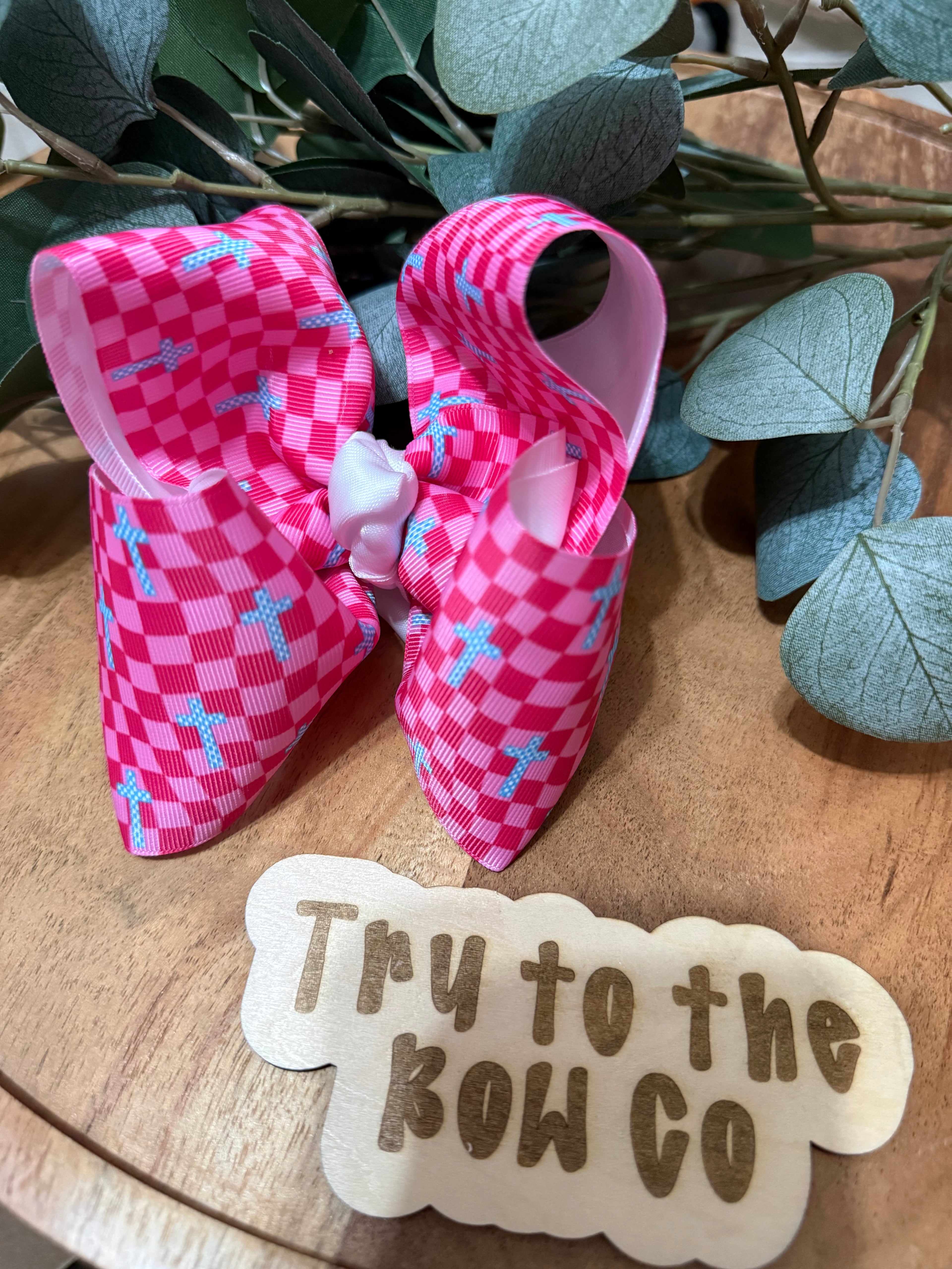 Pink check with cross